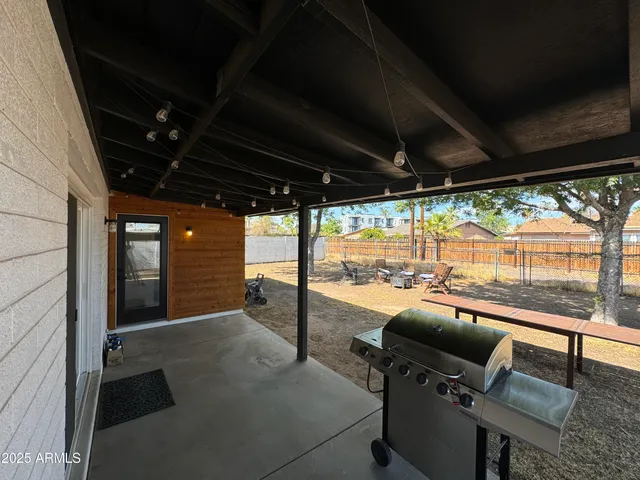 a view of a room with table and chairs