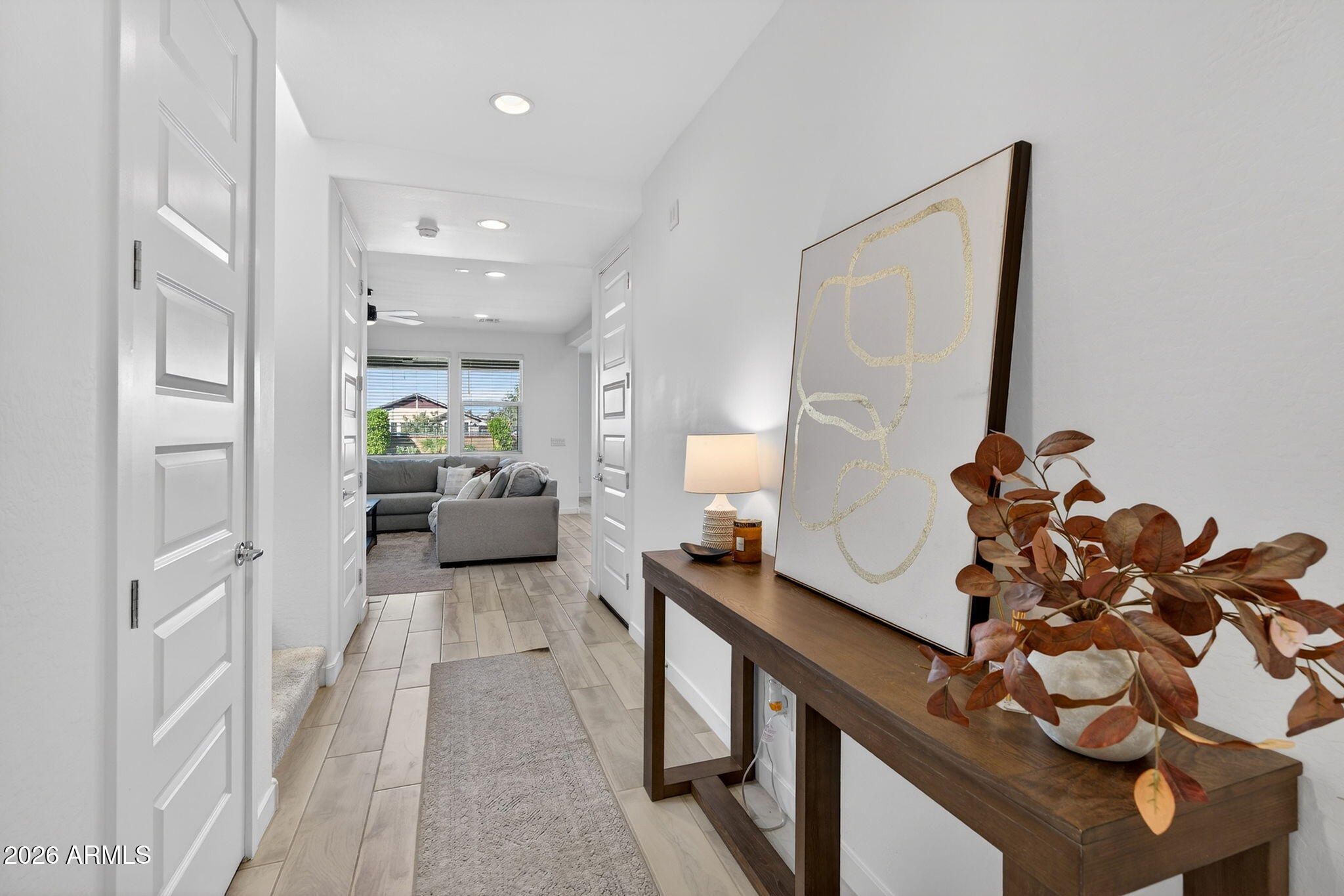 4112 East Appaloosa Road Gilbert, AZ 85296 - Photo 8 of 66 a living room with furniture and a chandelier