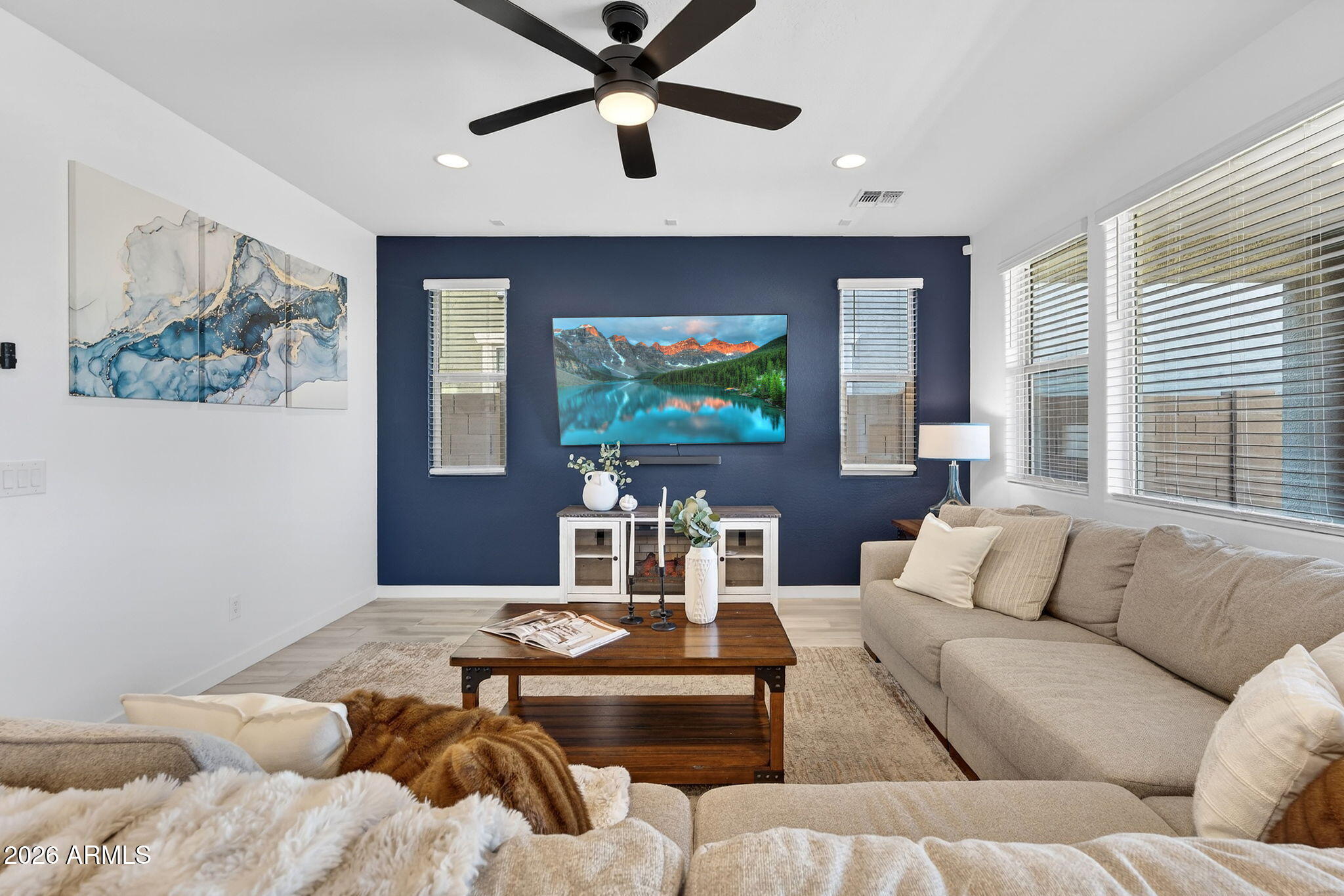 4112 East Appaloosa Road Gilbert, AZ 85296 - Photo 10 of 66 a living room with furniture and a flat screen tv