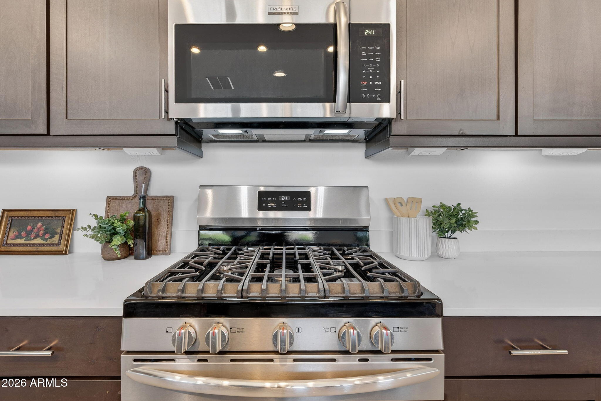 4112 East Appaloosa Road Gilbert, AZ 85296 - Photo 18 of 66 a stove top oven sitting inside of a kitchen