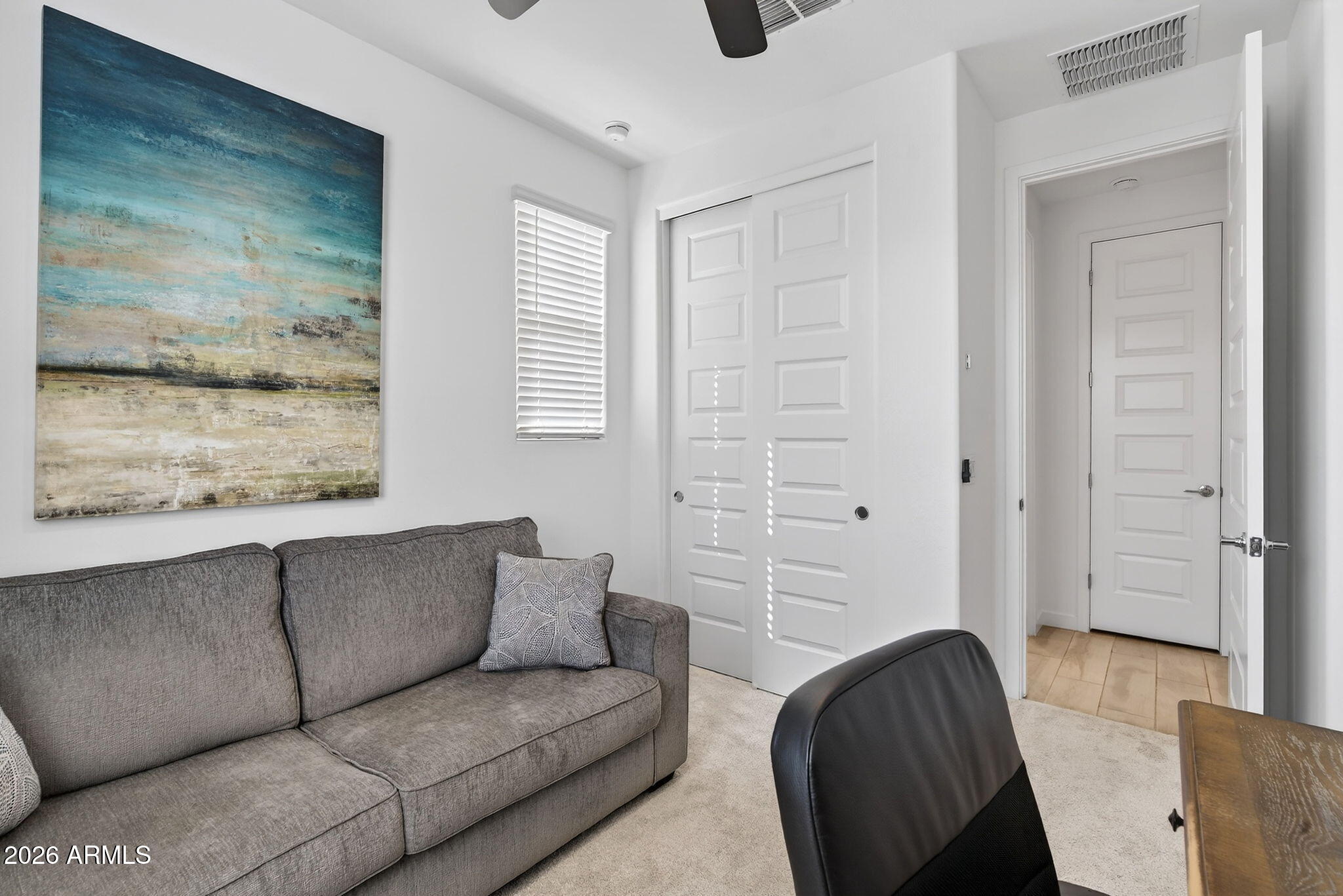 4112 East Appaloosa Road Gilbert, AZ 85296 - Photo 22 of 66 a living room with furniture and a gate