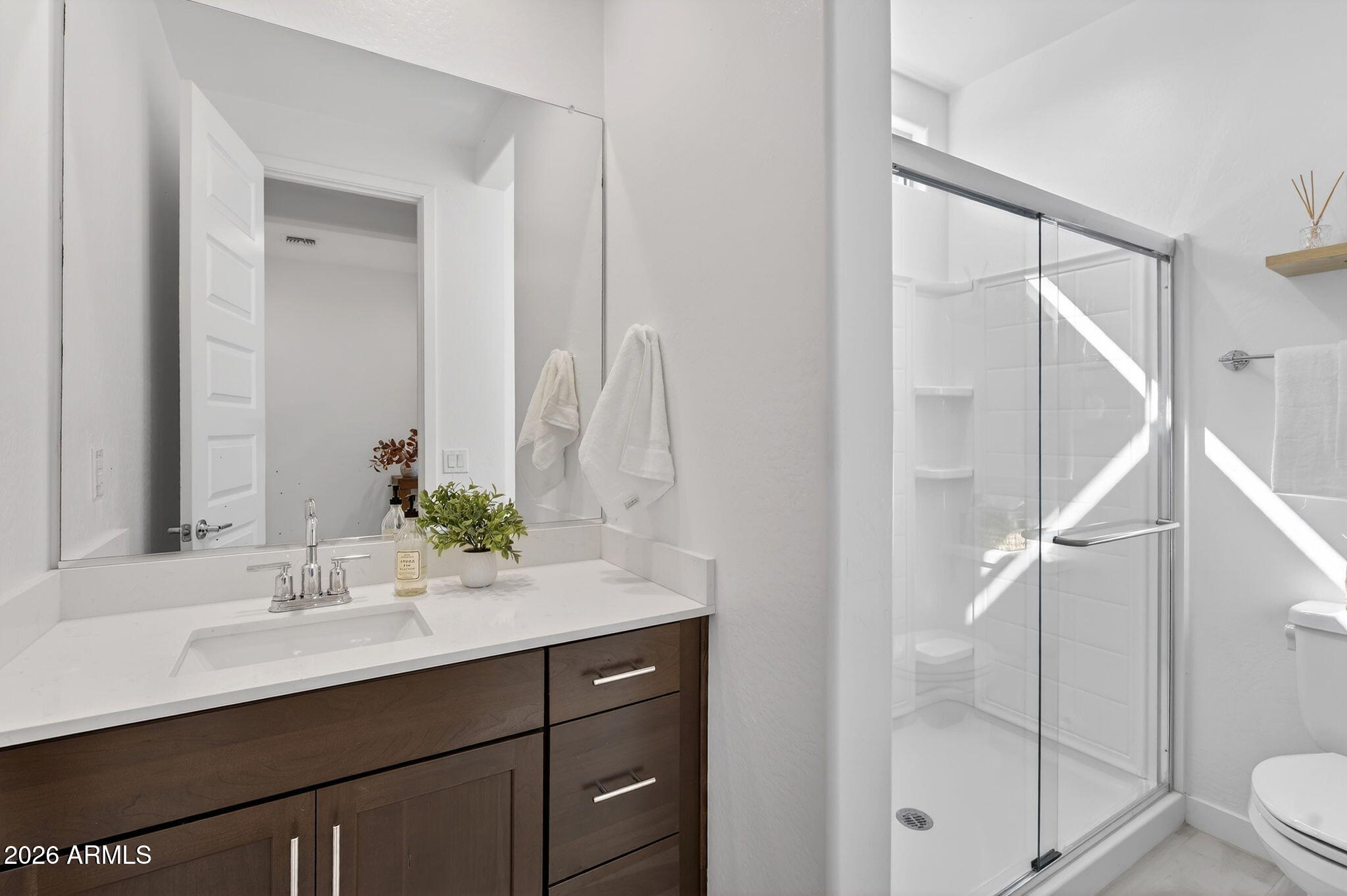 4112 East Appaloosa Road Gilbert, AZ 85296 - Photo 24 of 66 a bathroom with a sink and mirror with toilet
