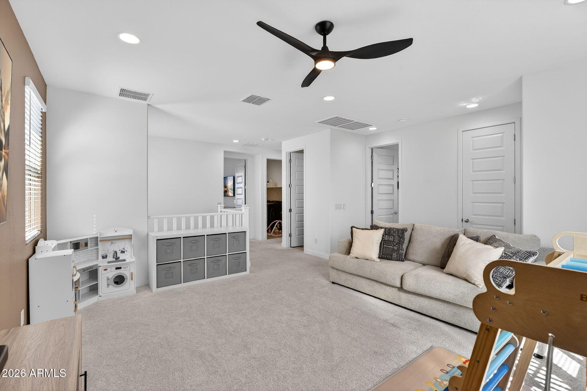 4112 East Appaloosa Road Gilbert, AZ 85296 - Photo 28 of 66 a living room with furniture and a ceiling fan