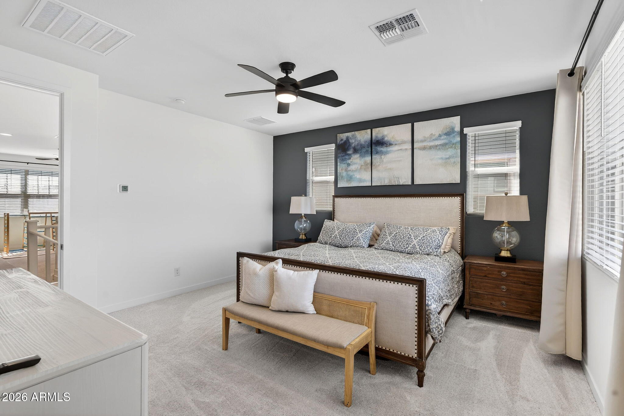 4112 East Appaloosa Road Gilbert, AZ 85296 - Photo 29 of 66 a bedroom with a bed and a chandelier