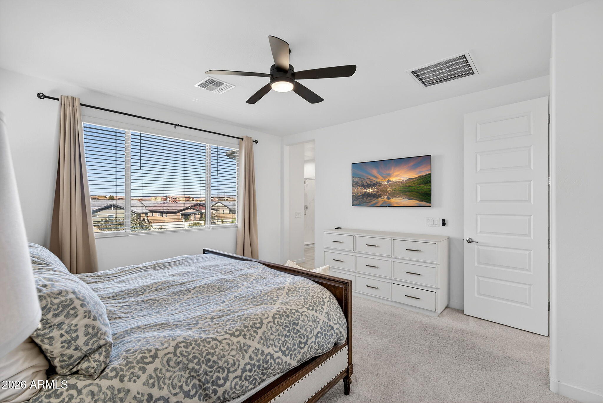 4112 East Appaloosa Road Gilbert, AZ 85296 - Photo 31 of 66 a bedroom with a bed and a flat screen tv