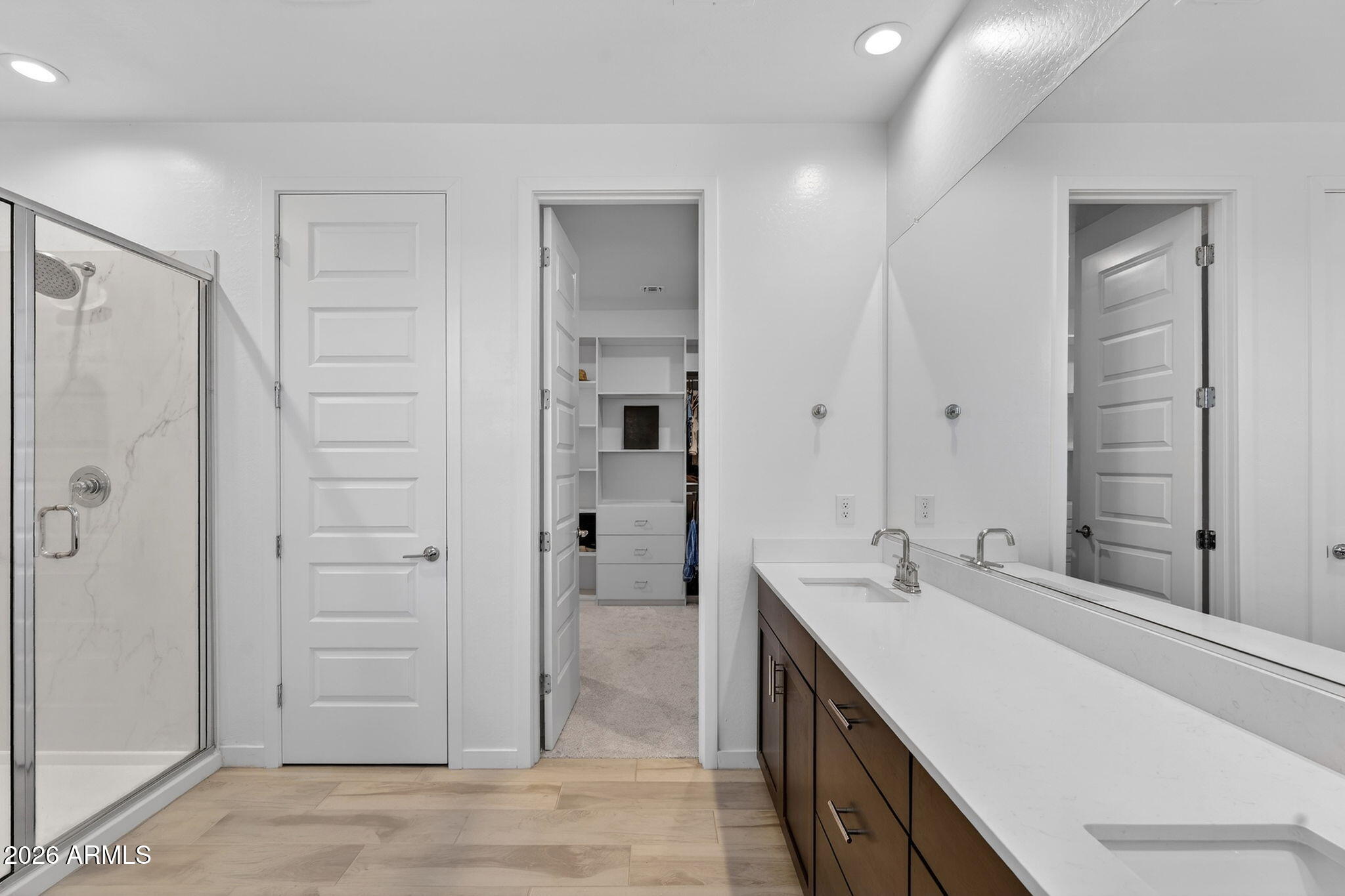 4112 East Appaloosa Road Gilbert, AZ 85296 - Photo 32 of 66 a bathroom with a double vanity sink a mirror and a shower