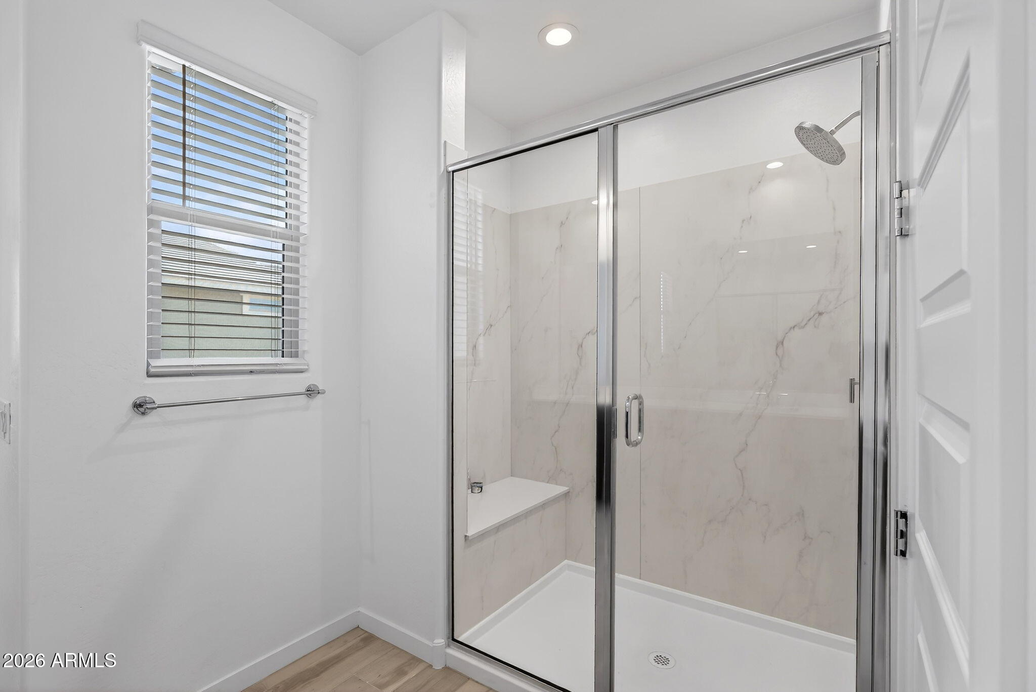 4112 East Appaloosa Road Gilbert, AZ 85296 - Photo 34 of 66 a bathroom with a glass shower door