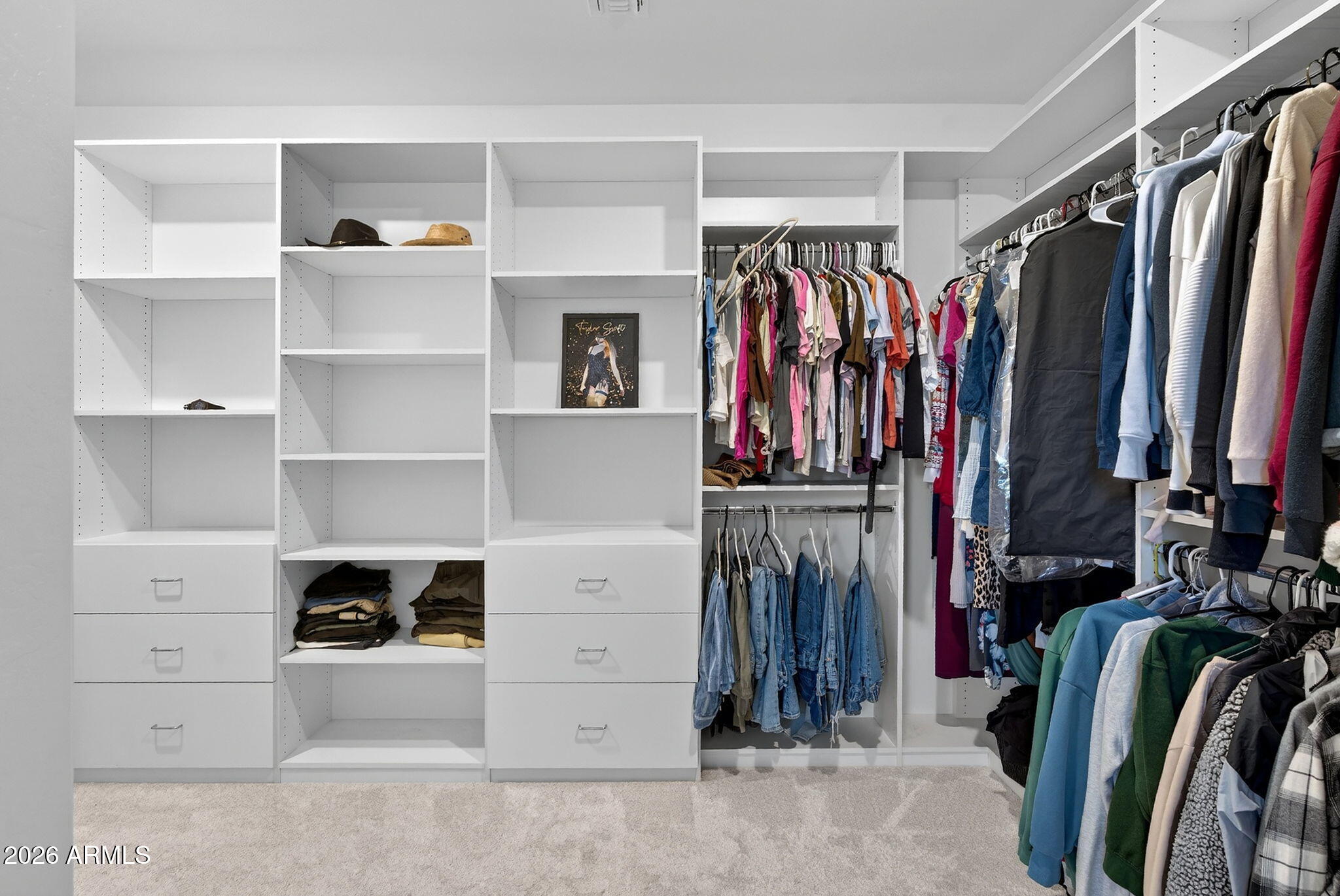 4112 East Appaloosa Road Gilbert, AZ 85296 - Photo 36 of 66 a view of walk in closet with clothes and shoes