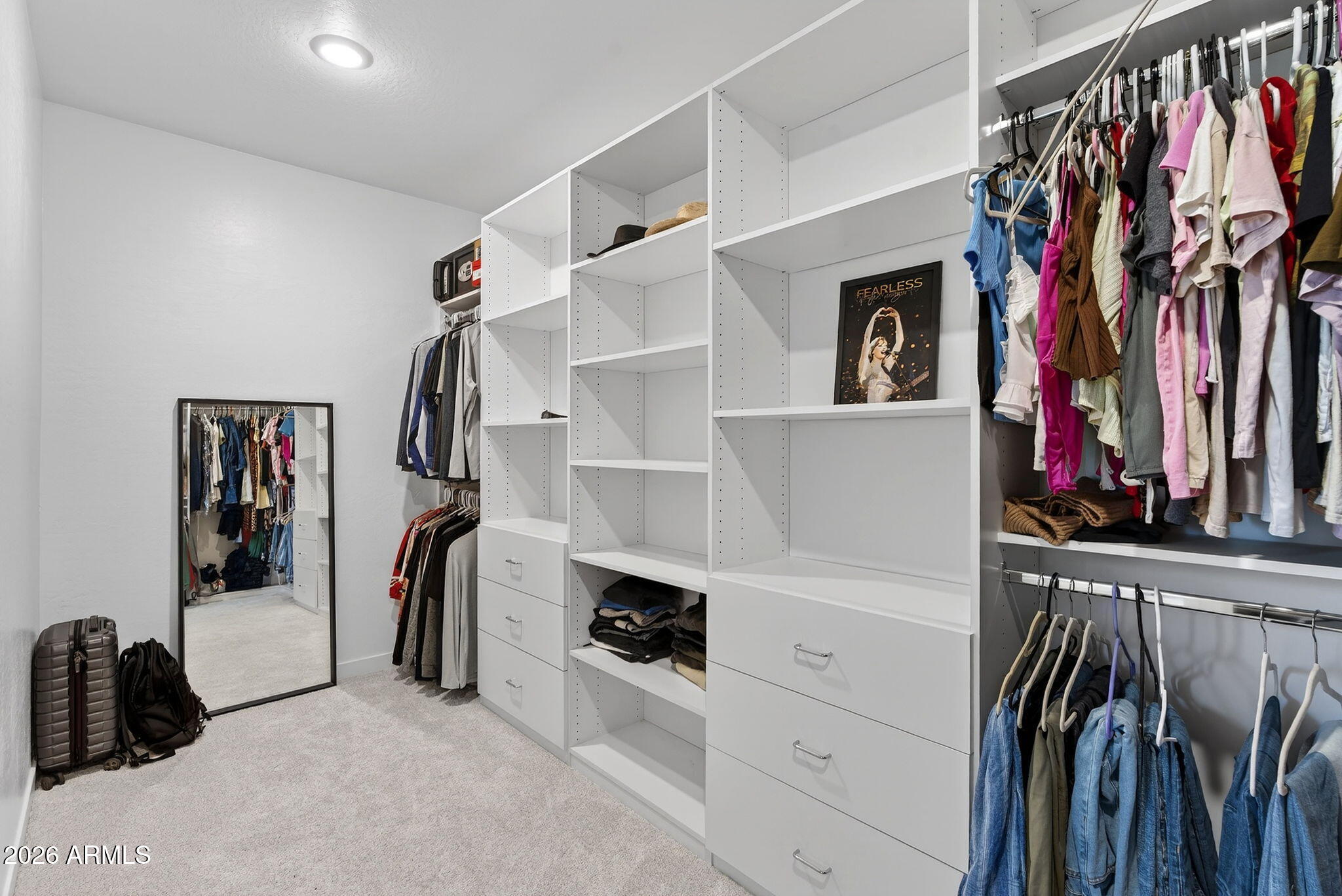 4112 East Appaloosa Road Gilbert, AZ 85296 - Photo 37 of 66 a view of walk in closet with clothes and shoes