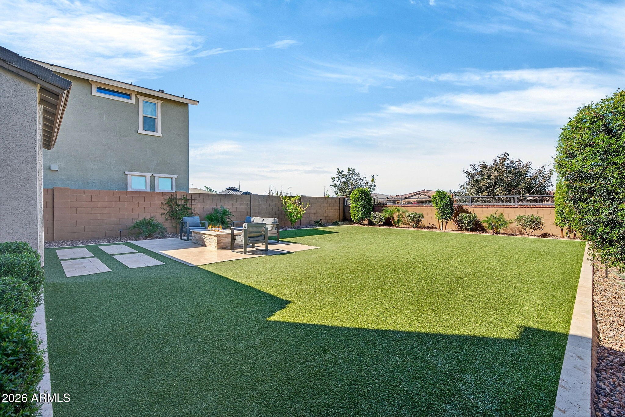 4112 East Appaloosa Road Gilbert, AZ 85296 - Photo 46 of 66 a view of a house with a yard and sitting area
