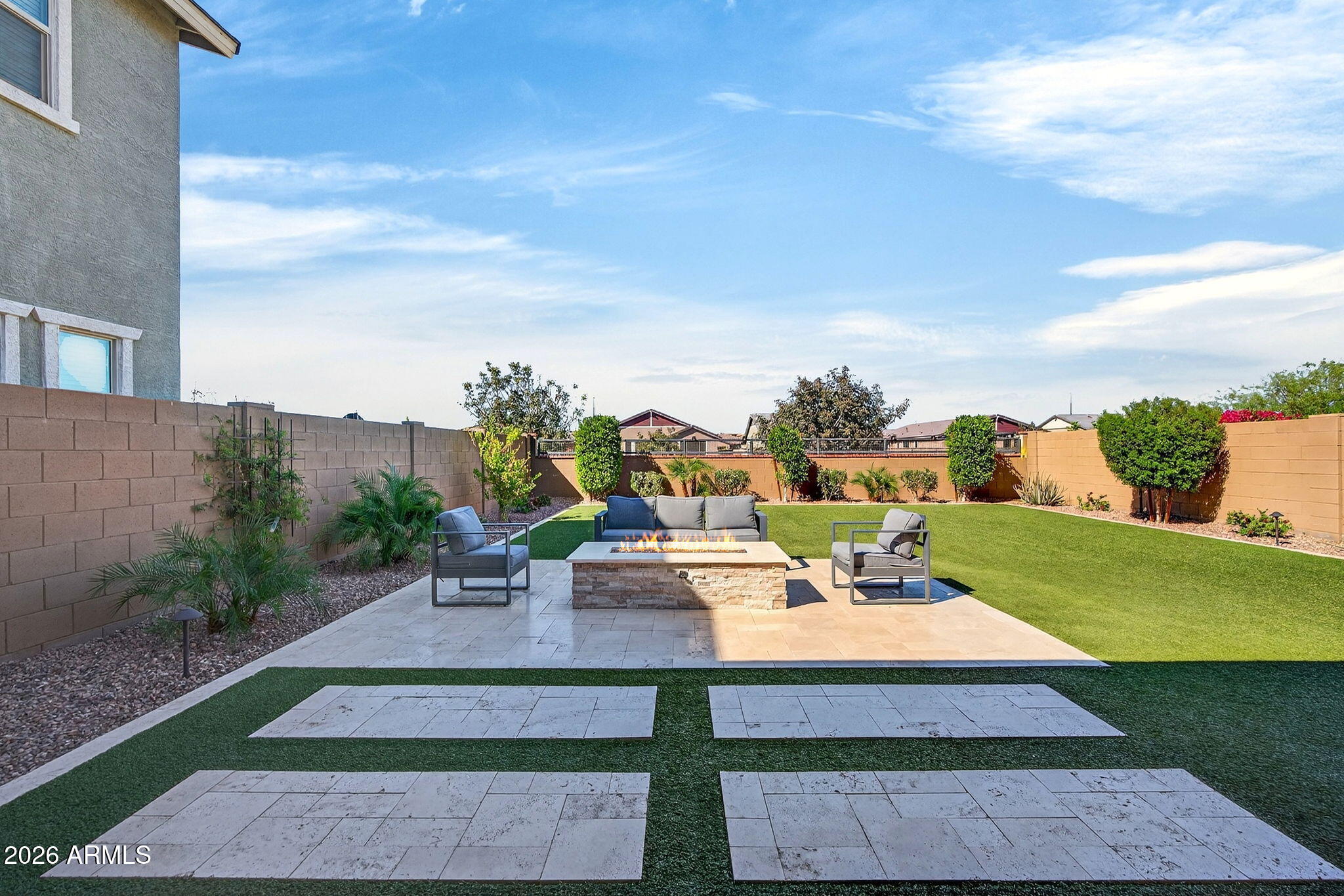 4112 East Appaloosa Road Gilbert, AZ 85296 - Photo 48 of 66 a view of a patio with a table and chairs