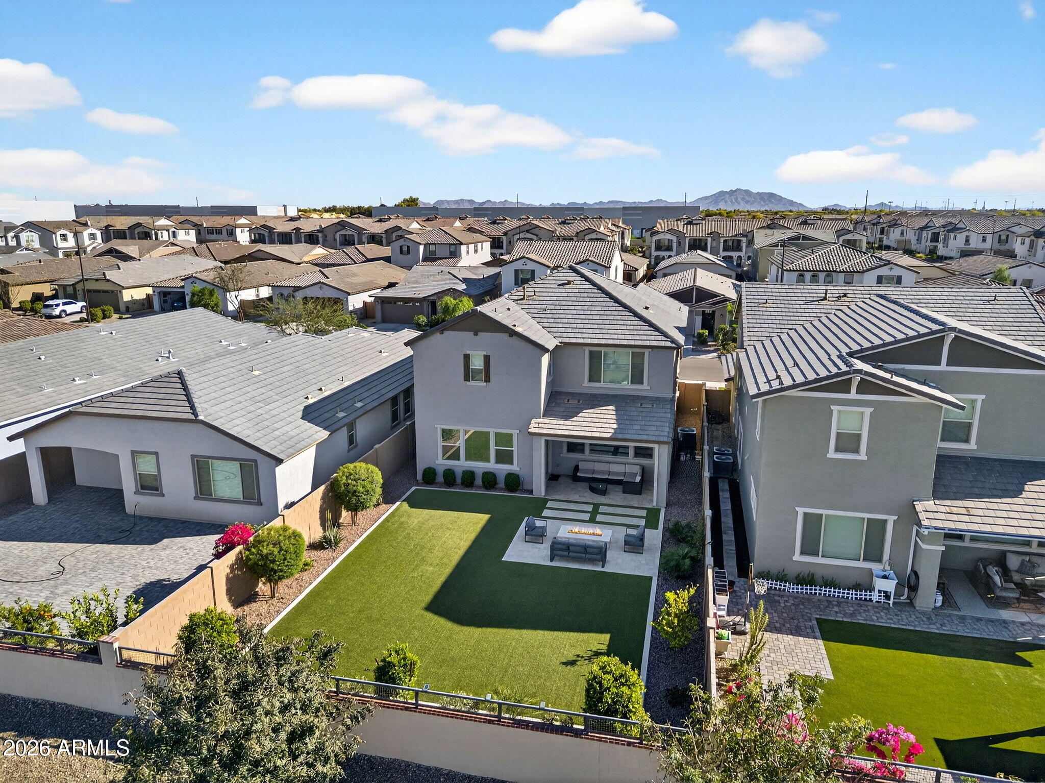 4112 East Appaloosa Road Gilbert, AZ 85296 - Photo 58 of 66 an aerial view of a house with a swimming pool yard and mountain view in back