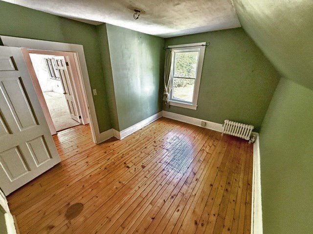 60 Massasoit Street Northampton, MA 01060 - Photo 14 of 19 a view of an empty room with wooden floor and a window