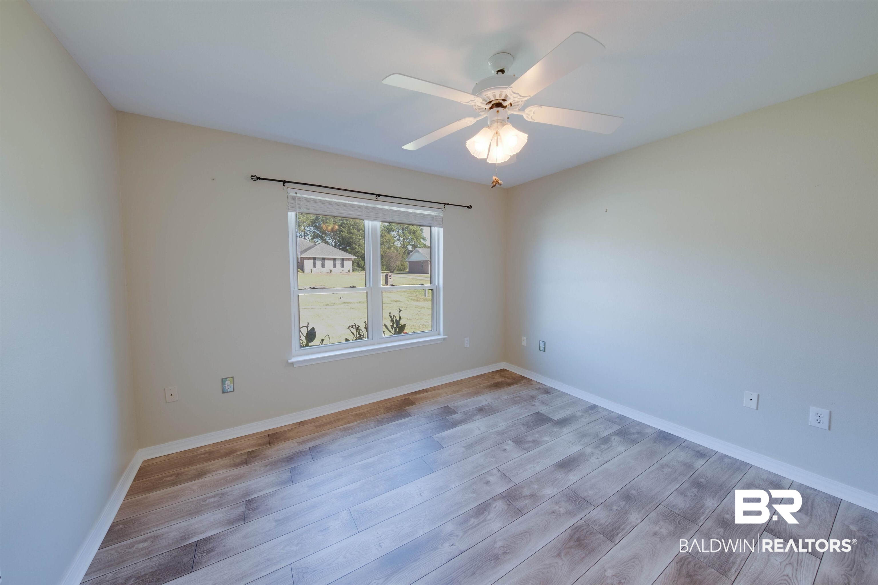 9462 Lakeview Drive Foley, AL 36535 - Photo 40 of 50 Empty room with light wood-type flooring and ceiling fan