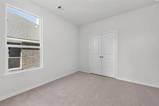 a view of empty room with windows