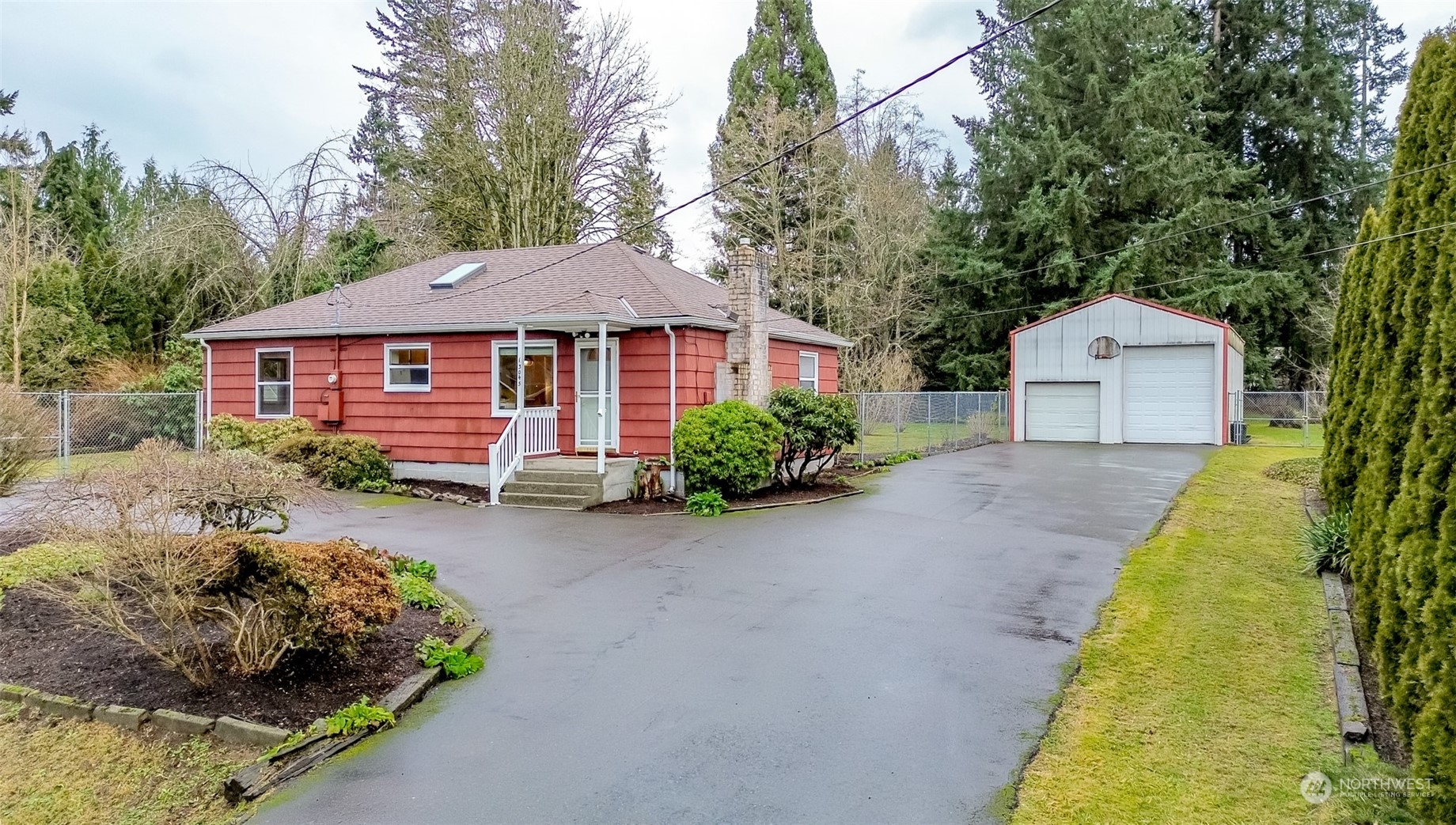 13045 166th Avenue Southeast Renton, WA 98059 - Photo 1 of 40 a front view of a house with a garden and porch
