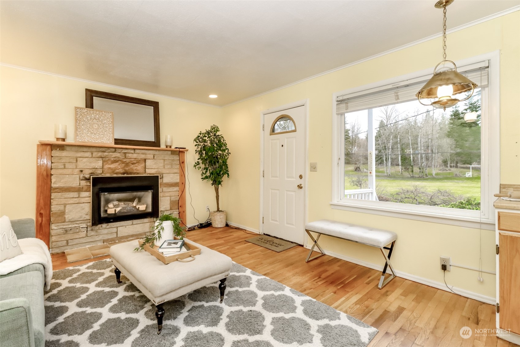 13045 166th Avenue Southeast Renton, WA 98059 - Photo 16 of 40 a living room with furniture and a fireplace
