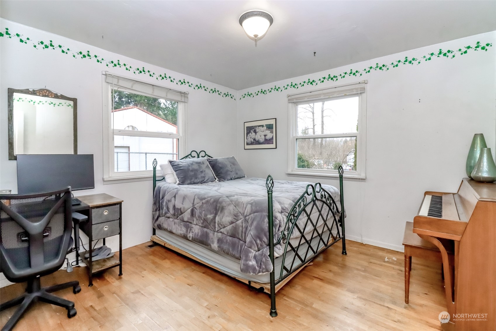 13045 166th Avenue Southeast Renton, WA 98059 - Photo 29 of 40 a bedroom with a bed and a window