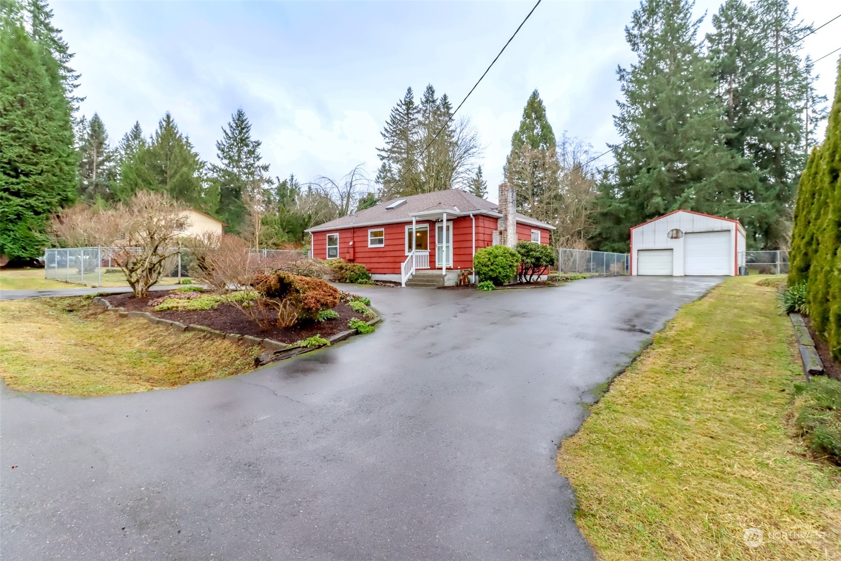 13045 166th Avenue Southeast Renton, WA 98059 - Photo 3 of 40 a view of a house with backyard and trees