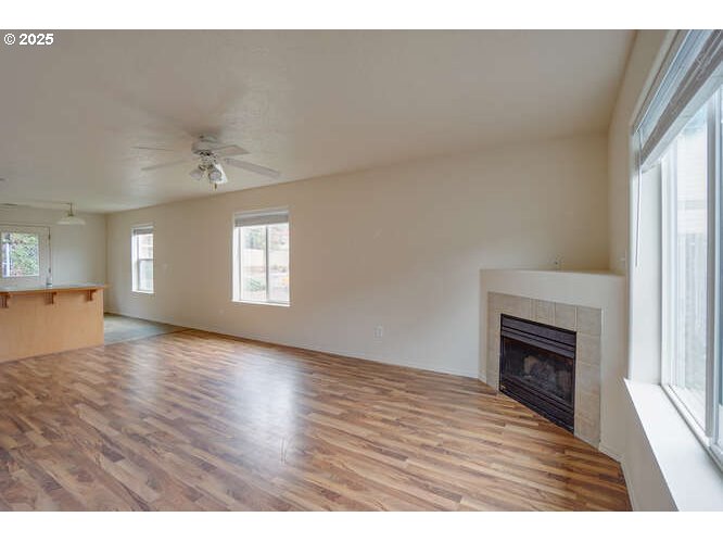 4000 Northeast 109th Avenue, Unit 53 Vancouver, WA 98682 - Photo 5 of 27 a view of an empty room with window and wooden floor