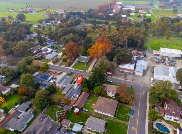 an aerial view of a house with a garden