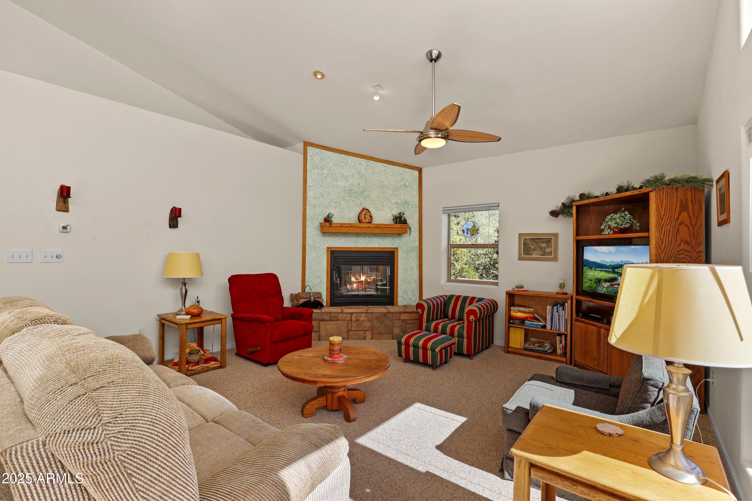 989 Verde Road Payson, AZ 85541 - Photo 12 of 44 a living room with furniture and a fireplace