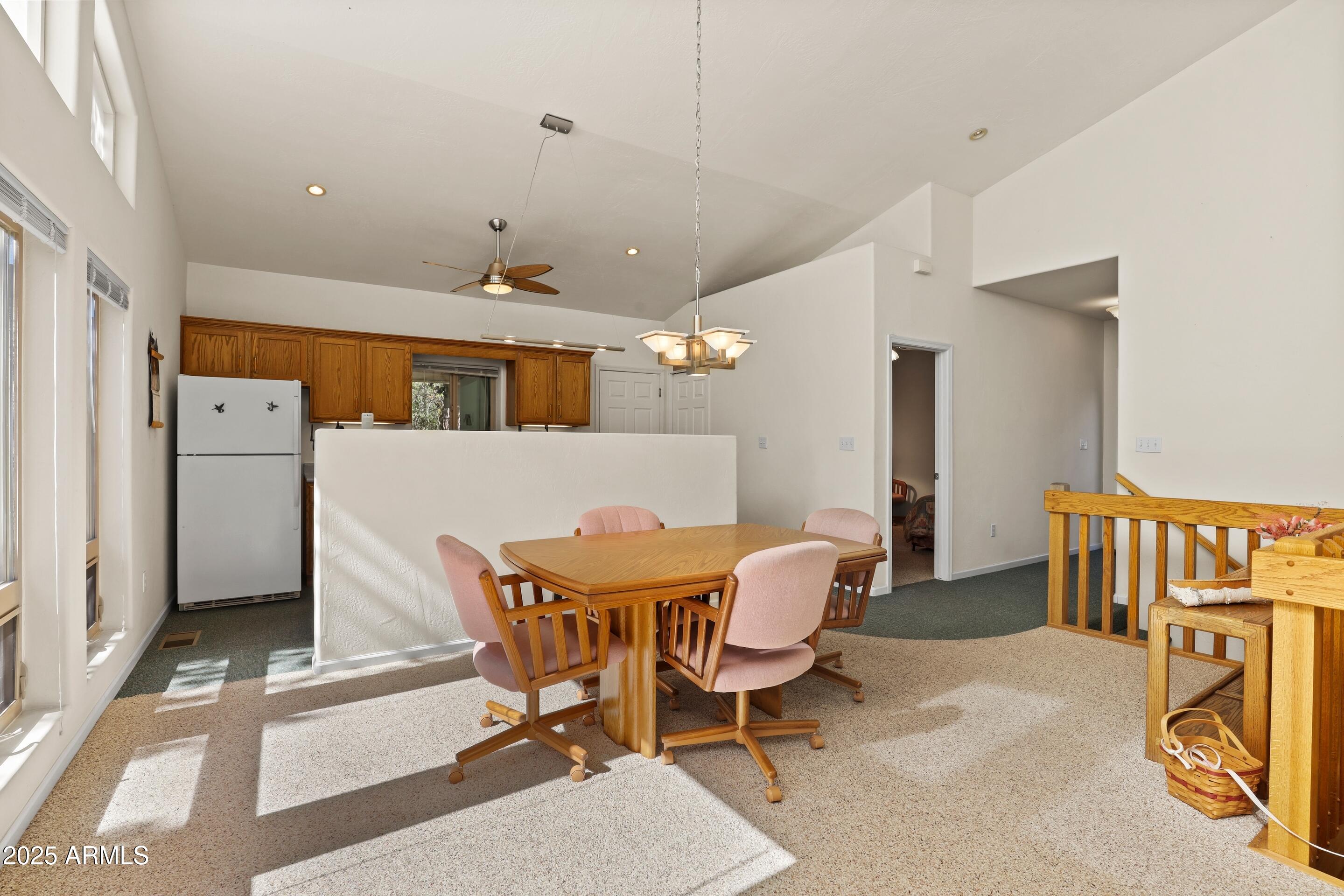 989 Verde Road Payson, AZ 85541 - Photo 14 of 44 a view of a dining room with furniture and a chandelier
