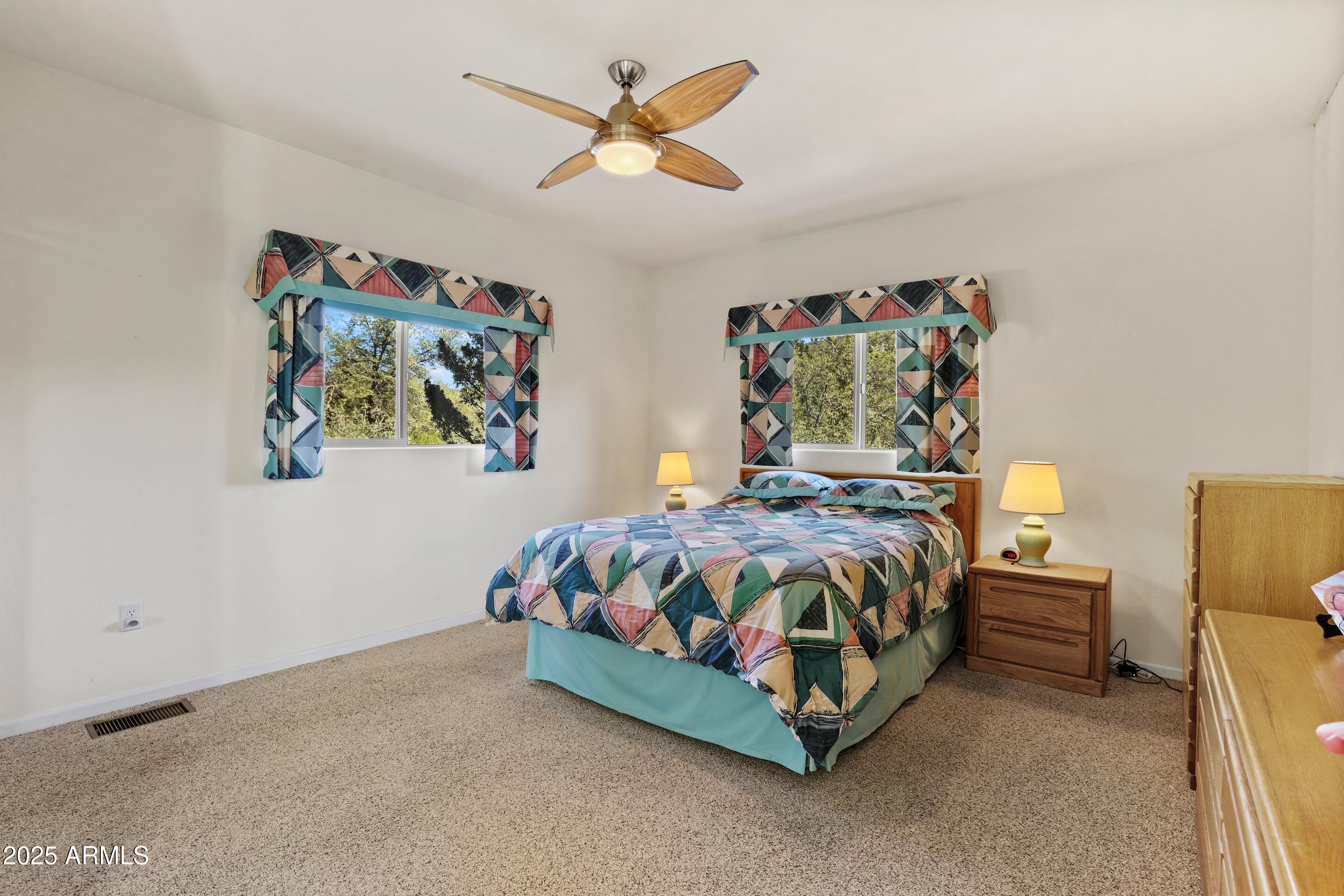 989 Verde Road Payson, AZ 85541 - Photo 18 of 44 a bed sitting in a bedroom next to a cabinet