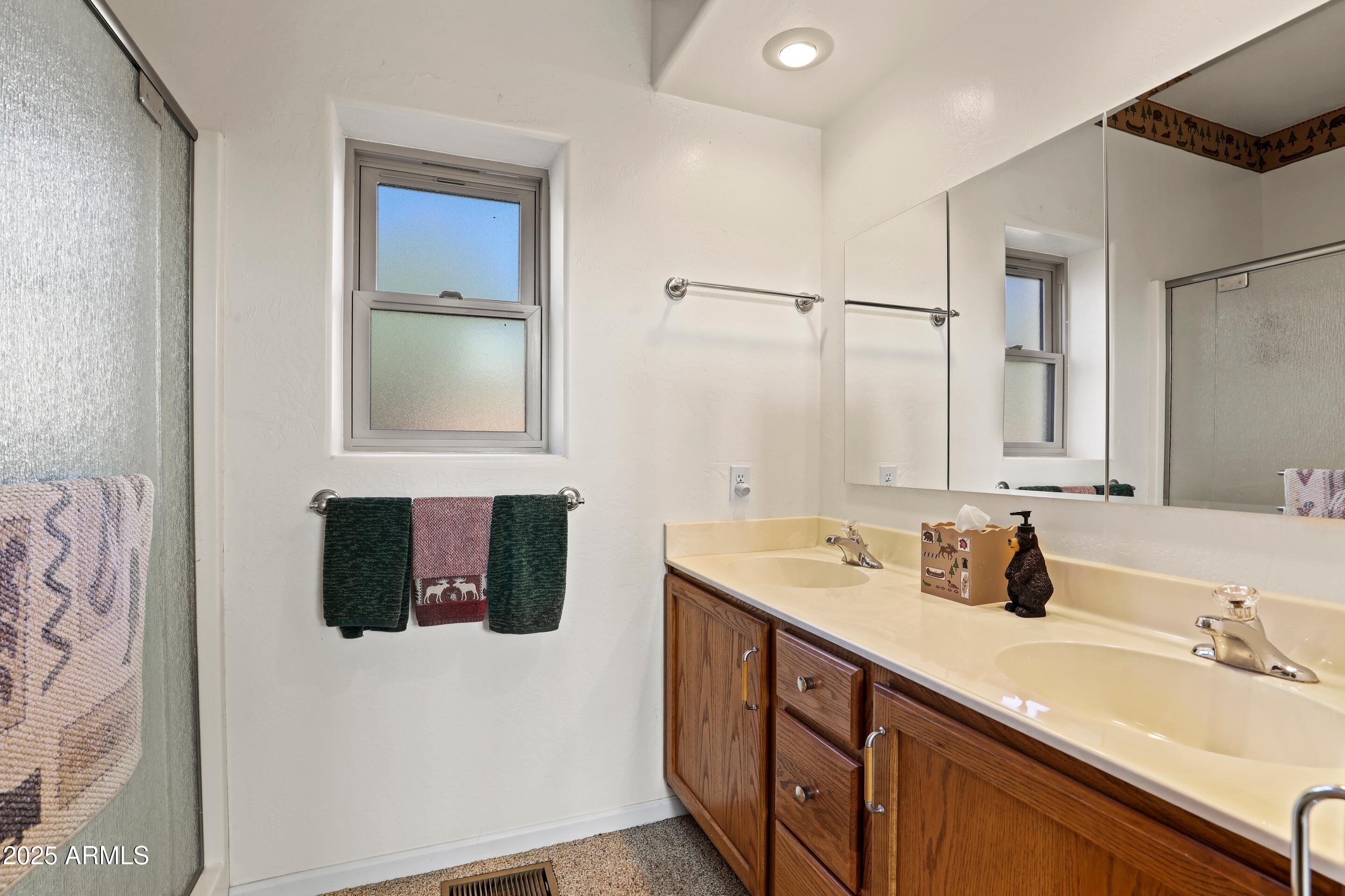 989 Verde Road Payson, AZ 85541 - Photo 20 of 44 a bathroom with a sink double vanity and a mirror