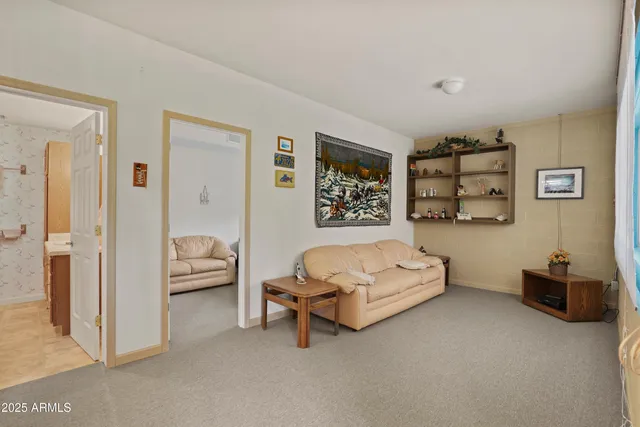 a spacious bedroom with a bed and a couch