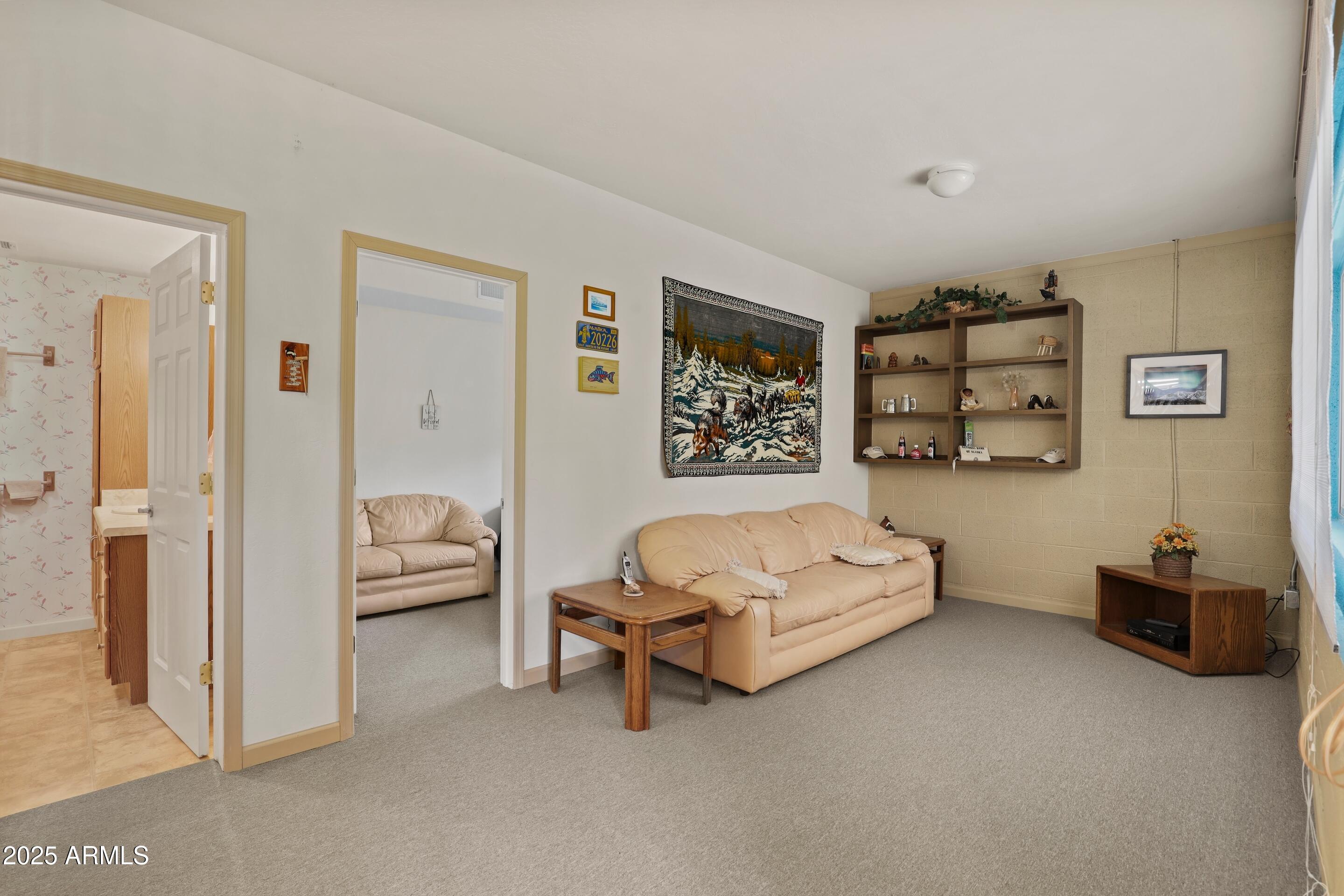 989 Verde Road Payson, AZ 85541 - Photo 24 of 44 a spacious bedroom with a bed and a couch