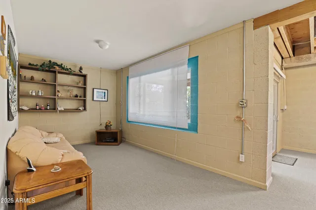 a bedroom with a bed and furniture