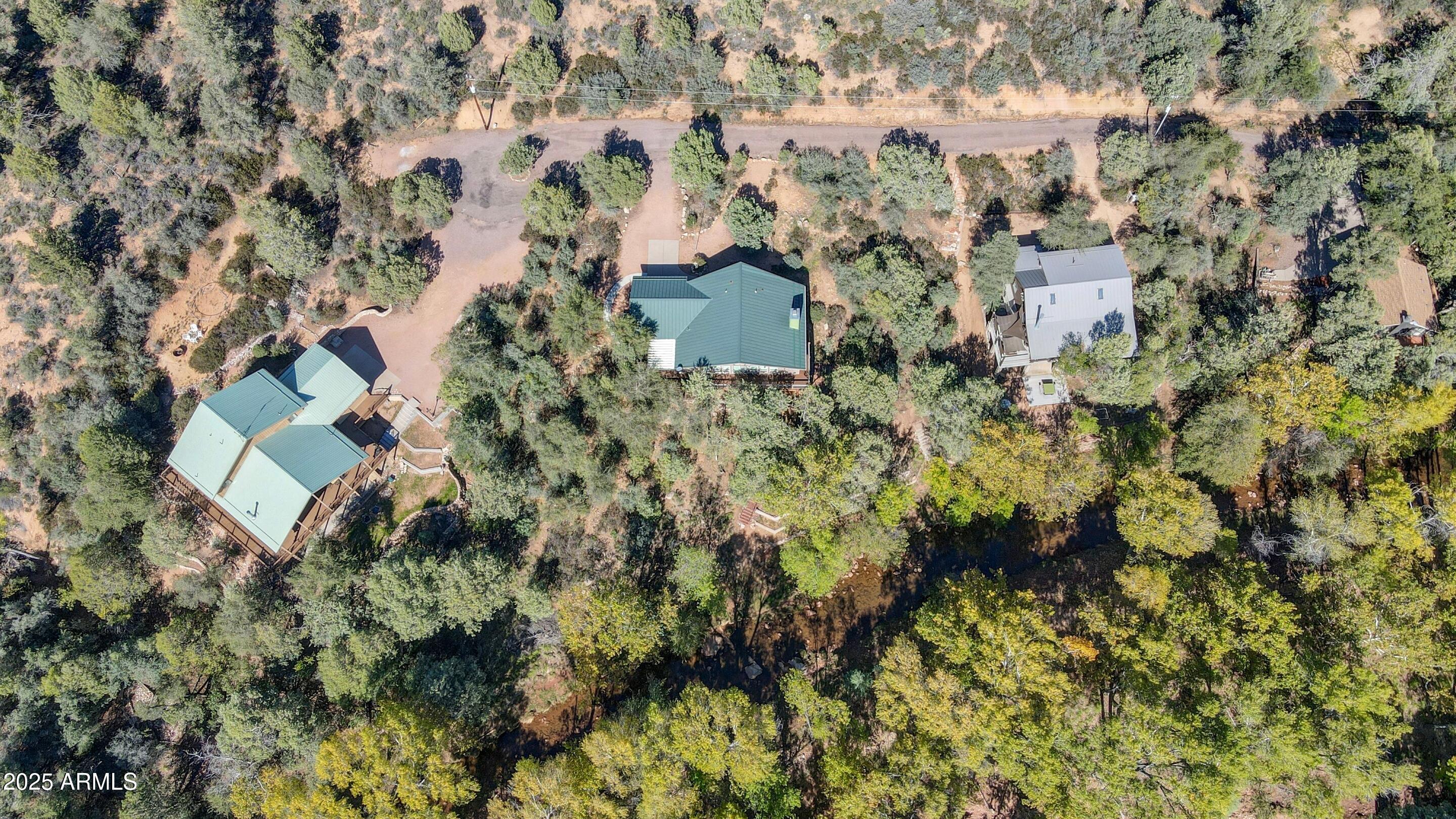 989 Verde Road Payson, AZ 85541 - Photo 39 of 44 a aerial view of a house with a yard and large trees