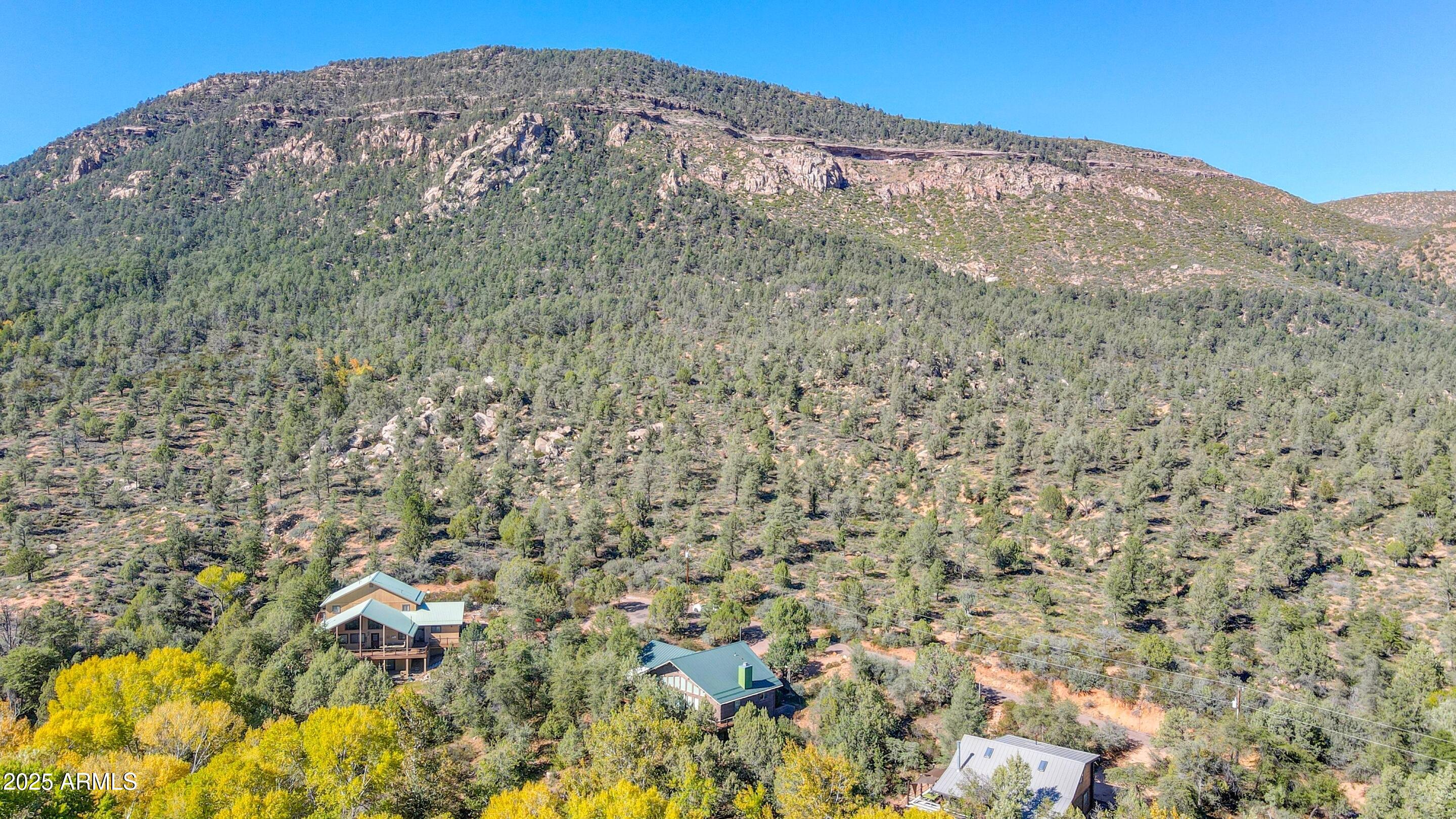 989 Verde Road Payson, AZ 85541 - Photo 41 of 44 a view of a large building with mountains in the background