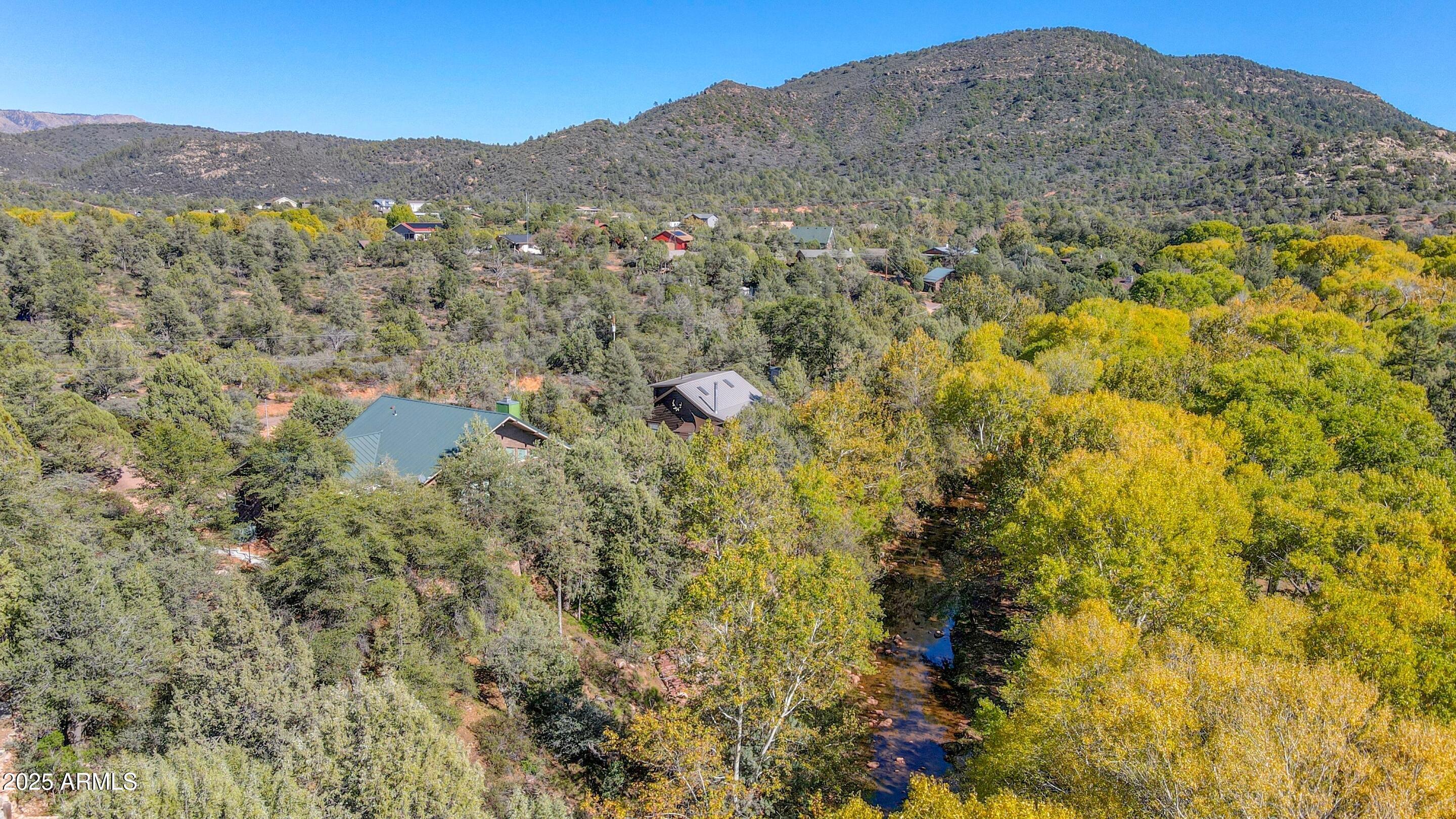 989 Verde Road Payson, AZ 85541 - Photo 43 of 44 a view of a lush green field with mountains in the background