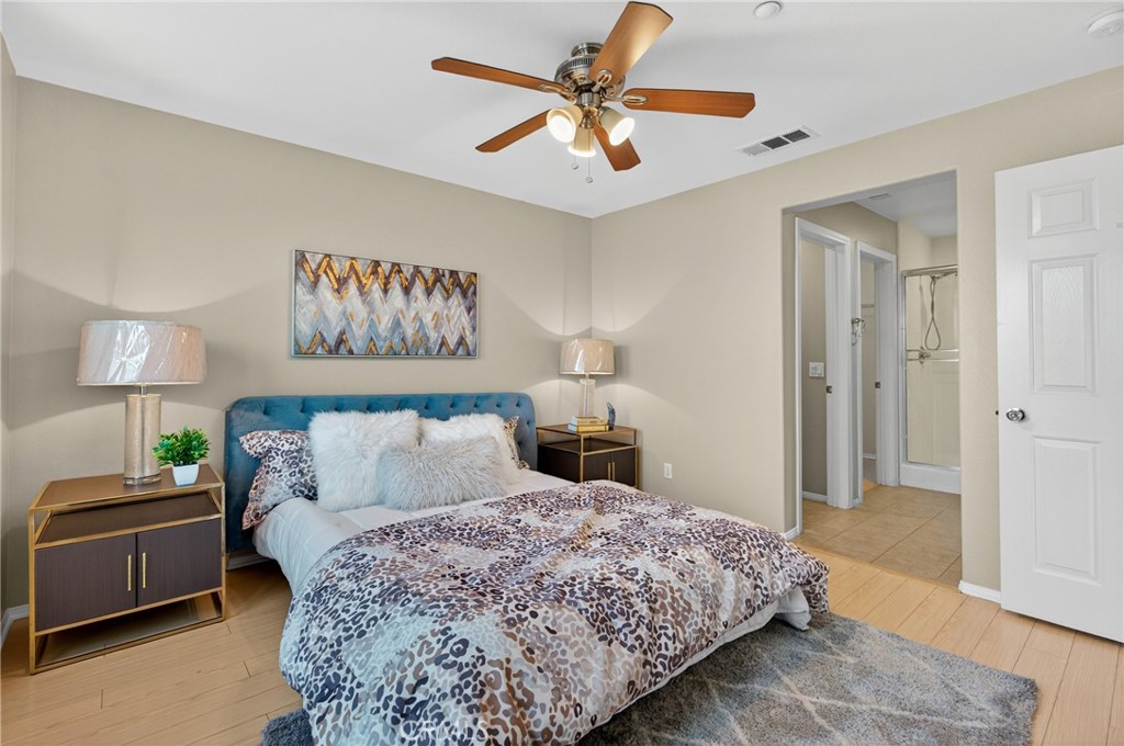 942 South 4th Street Montebello, CA 90640 - Photo 12 of 20 a bedroom with a bed and a lamp on a dresser
