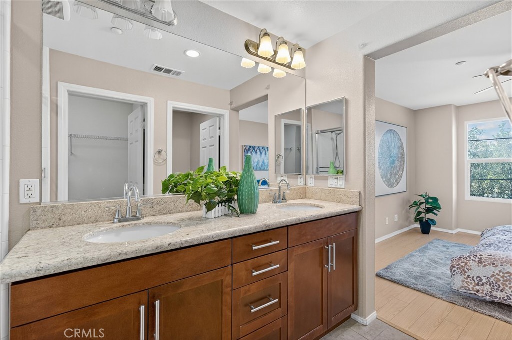 942 South 4th Street Montebello, CA 90640 - Photo 14 of 20 a bathroom with a granite countertop sink and a mirror