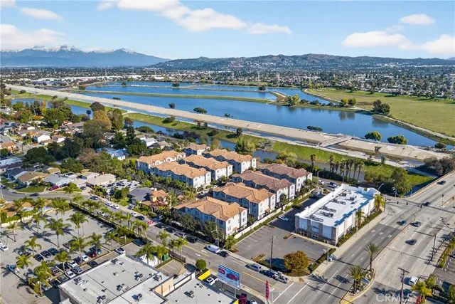 an aerial view of a city with an ocean view