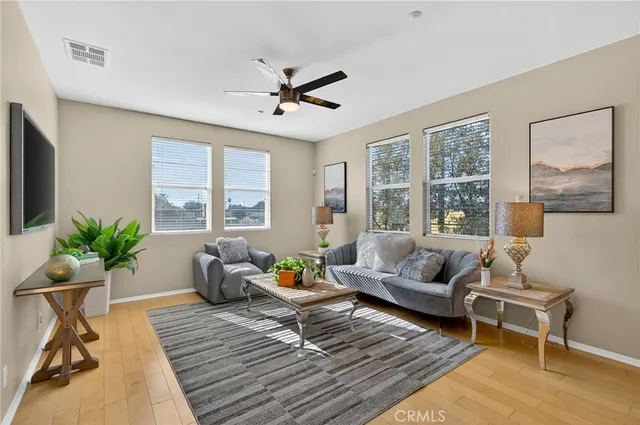 a living room with furniture and a large window