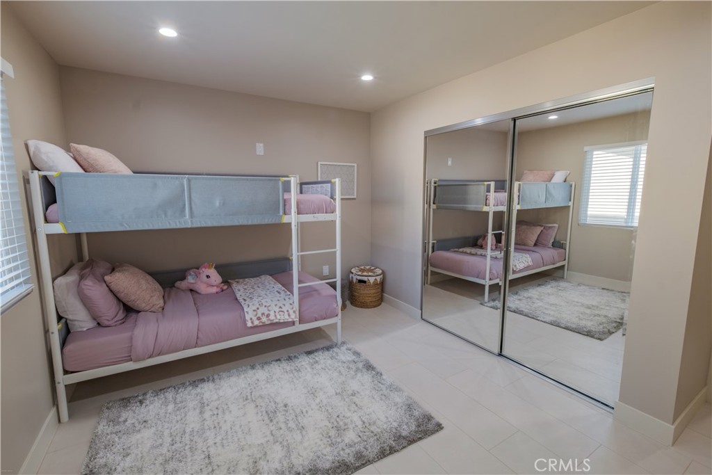 223 South Aprilia Avenue Compton, CA 90220 - Photo 36 of 46 a bedroom with furniture and a chair