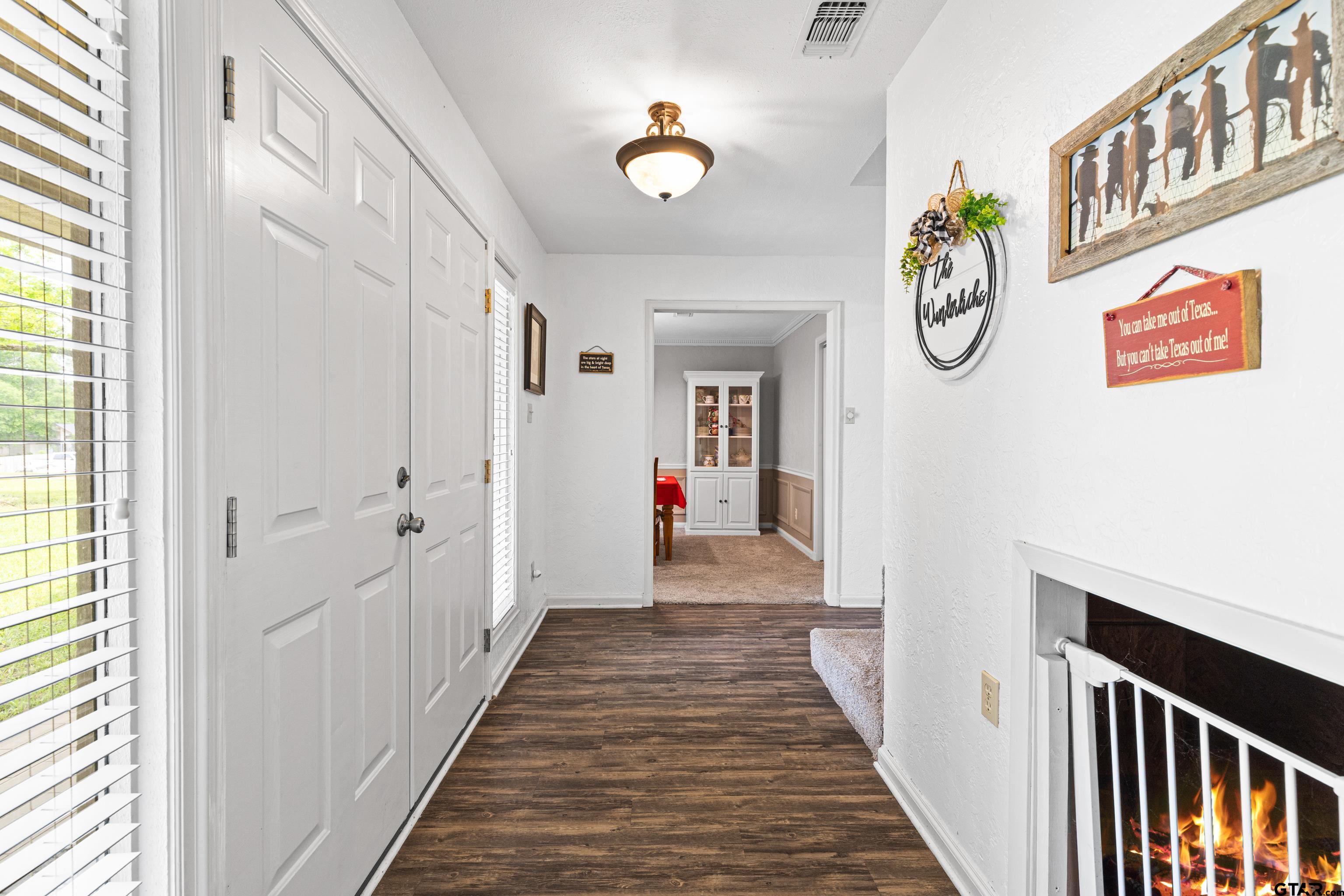 1810 Azalea Street Gilmer, TX 75644 - Photo 11 of 47 a view of a hallway to a livingroom with furniture