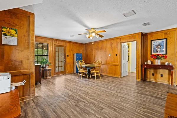 a view of a livingroom with furniture and a window