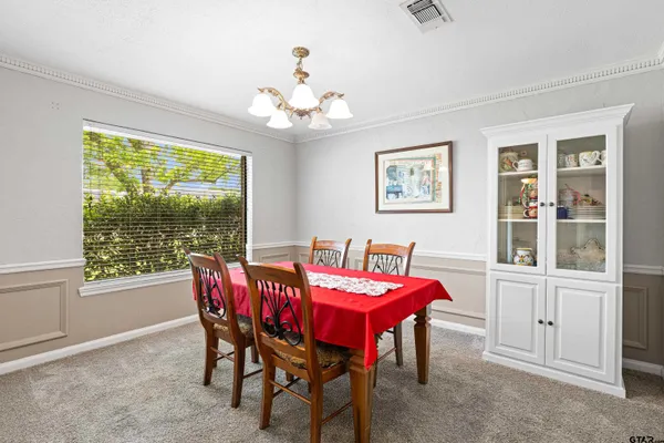 a view of a dining room with furniture window and outside view
