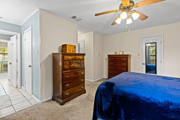 a bedroom with a bed and furniture