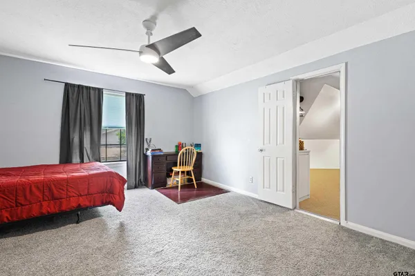 a bedroom with double bed and a window