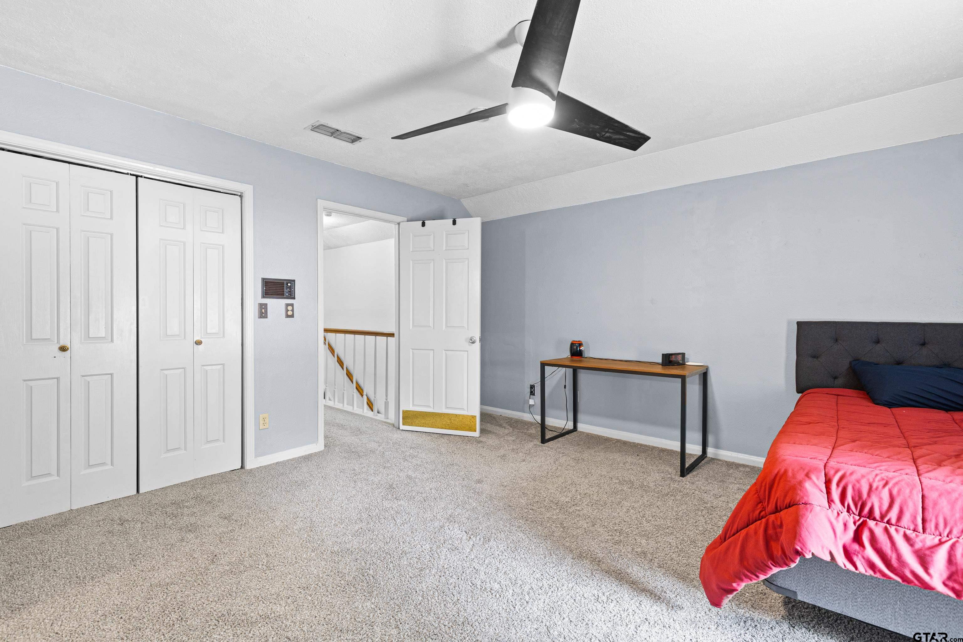 1810 Azalea Street Gilmer, TX 75644 - Photo 44 of 47 a bedroom with a bed and a dresser