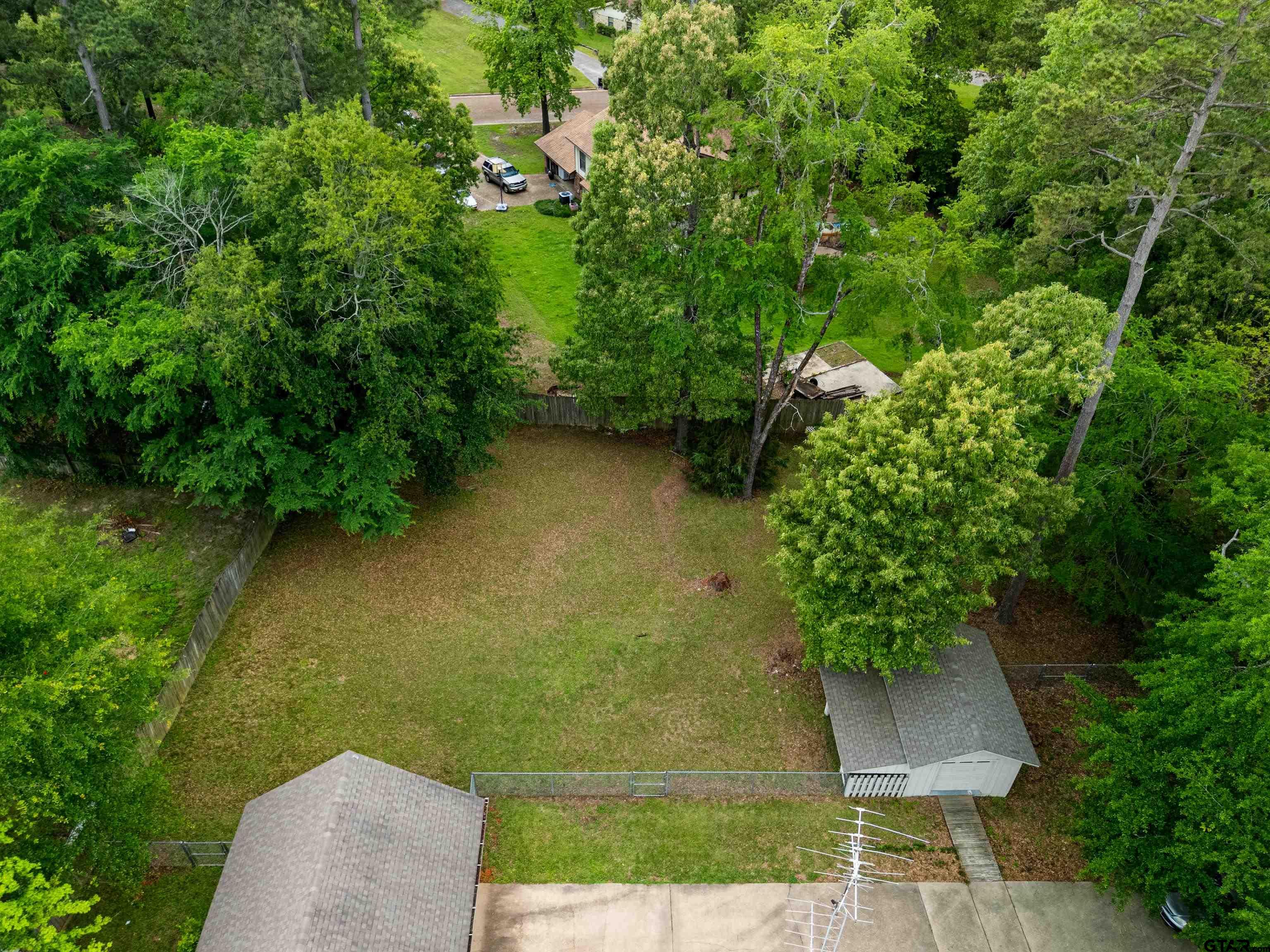 1810 Azalea Street Gilmer, TX 75644 - Photo 9 of 47 an aerial view of a residential houses with outdoor space and trees all around