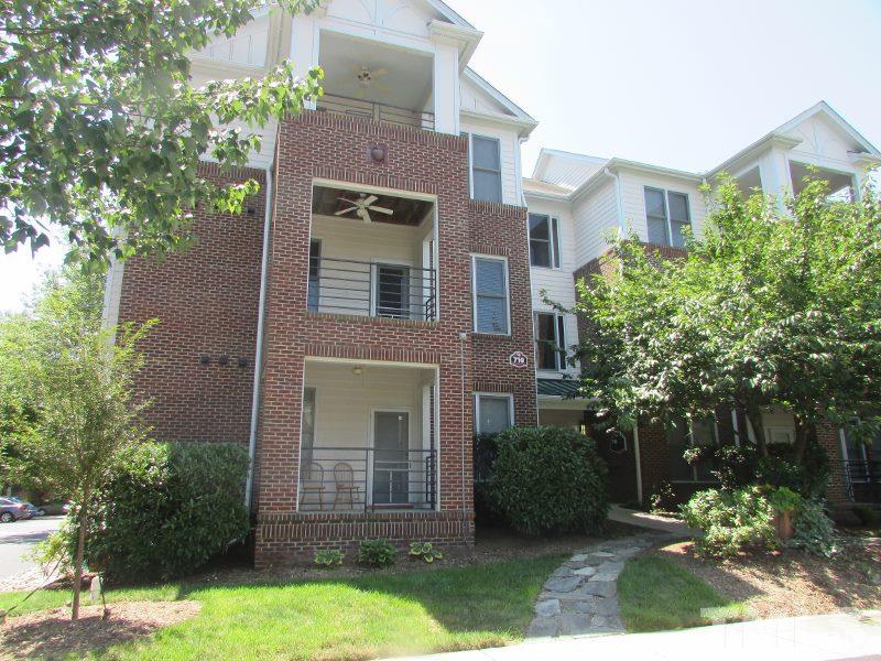 710 North Person Street, Unit 207 Raleigh, NC 27604 - Photo 1 of 12 front view of a house with a yard