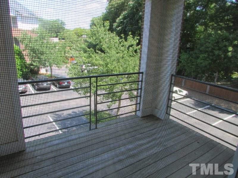 710 North Person Street, Unit 207 Raleigh, NC 27604 - Photo 12 of 12 a view of a balcony with wooden floor