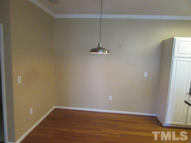 710 North Person Street, Unit 207 Raleigh, NC 27604 - Photo 4 of 12 a view of a room with wooden floor and fan